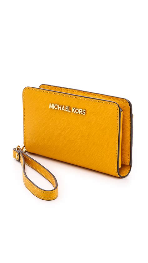 michael kors yellow wallet with studs|Michael Kors studded wallet.